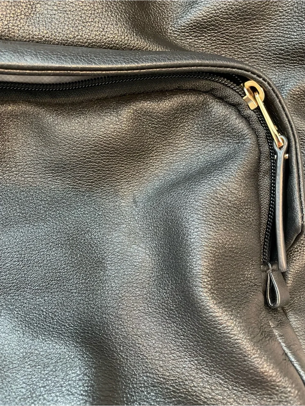 Tumi Black Leather Backpack with Goldtone Hardware